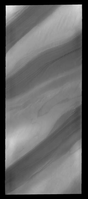 With summer fast approaching, the frost has sublimated away and the layers that make up the north polar cap are easily discernable, as seen by NASA 2001 Mars Odyssey spacecraft.