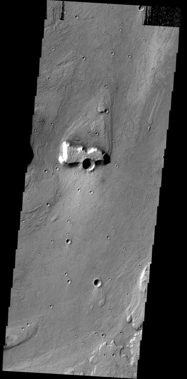 This image from NASA 2001 Mars Odyssey spacecraft shows a streamlined island in a broad channel in Chryse Planitia. The channel is part of the outflow region of Lobo Vallis, a northern branch of Kasei Valles.
