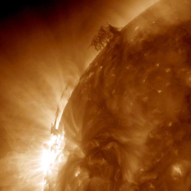 This still image from an animation from NASA GSFC Solar Dynamics Observatory shows dark strands of plasma hovering above the Sun surface beginning to interact with each other in a form of tug of war over two and a half days June 28-30, 2015.