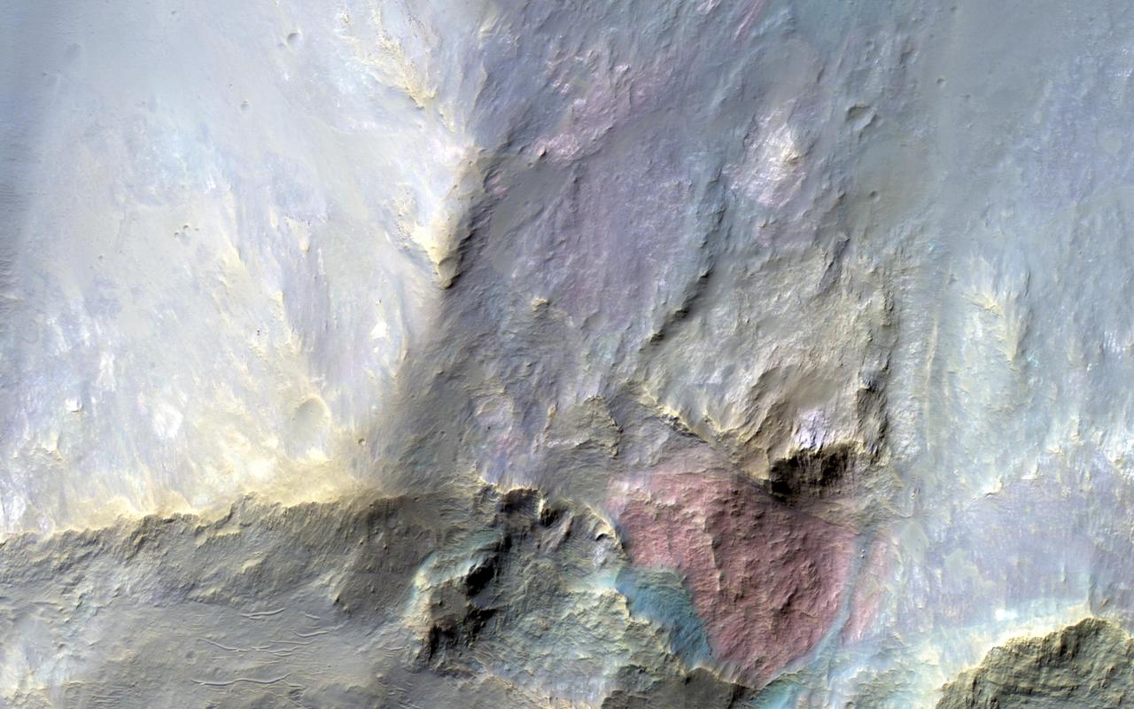 This image covers a 26-kilometer-wide impact crater northeast of the Hellas impact basin as observed by NASA Mars Reconnaissance Orbiter.