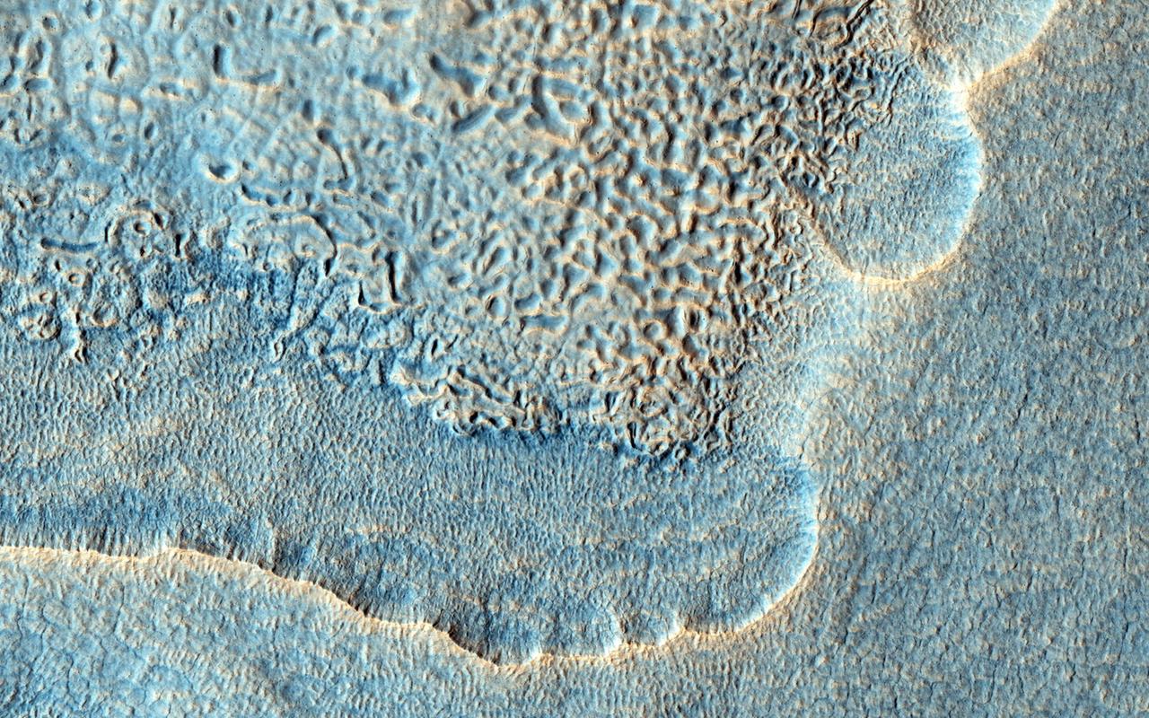 The objective of this observation by NASA Mars Reconnaissance Orbiter was to examine the edge of impact ejecta from a crater to the north-west of this area north is up, west is to the left.