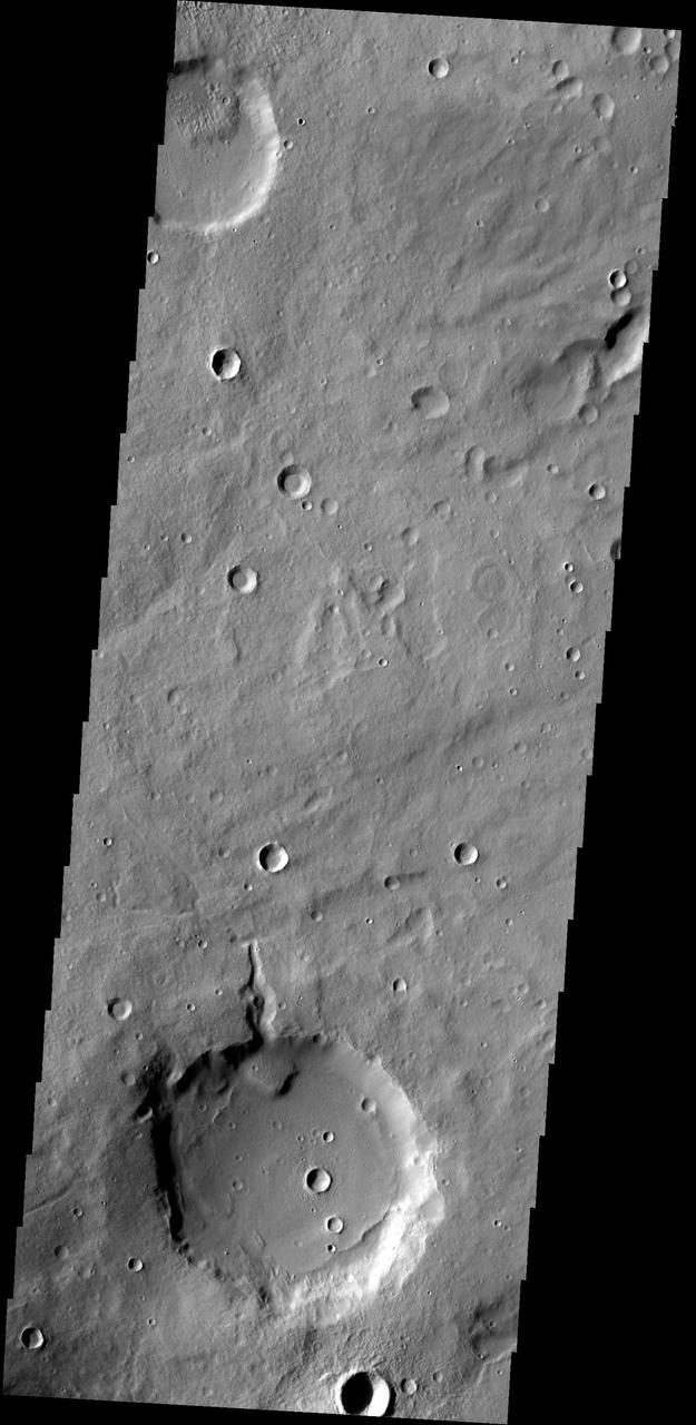 A delta deposit sits on the floor of this unnamed crater in Arabia Terra, as shown in this image from NASA 2001 Mars Odyssey spacecraft. The channel that created the delta dissects the crater rim.
