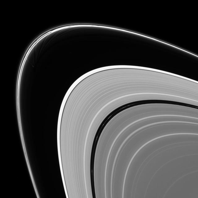 Prometheus is caught in the act of creating gores and streamers in the F ring. Scientists believe that Prometheus and its partner-moon Pandora are responsible for much of the structure in the F ring as shown by NASA Cassini spacecraft. The orbit of Prometheus (53 miles, or 86 kilometers across) regularly brings it into the F ring. When this happens, it creates gores, or channels, in the ring where it entered. Prometheus then draws ring material with it as it exits the ring, leaving streamers in its wake. This process creates the pattern of structures seen in this image. This process is described in detail, along with a movie of Prometheus creating one of the streamer/channel features, in PIA08397. This view looks toward the sunlit side of the rings from about 8.6 degrees above the ringplane. The image was taken in visible light with the Cassini spacecraft narrow-angle camera on Feb. 11, 2014. The view was acquired at a distance of approximately 1.3 million miles (2.1 million kilometers) from Saturn and at a Sun-Saturn-spacecraft, or phase, angle of 147 degrees. Image scale is 8 miles (13 kilometers) per pixel. http://photojournal.jpl.nasa.gov/catalog/PIA18270