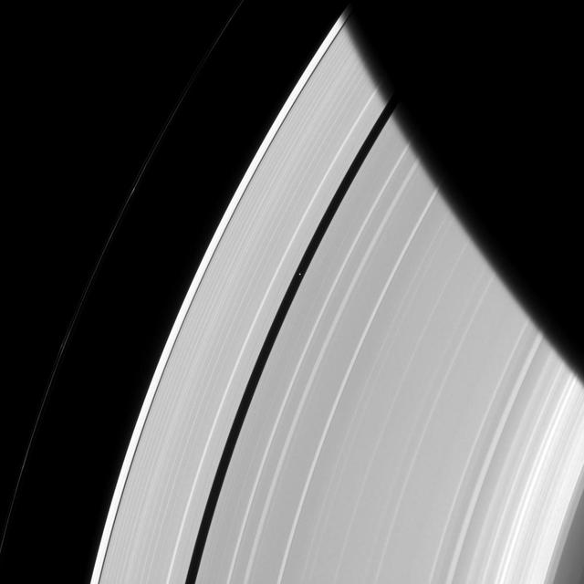 Saturn's innermost moon Pan orbits the giant planet seemingly alone in a ring gap its own gravity creates.  Pan (17 miles, or 28 kilometers across) maintains the Encke Gap in Saturn's A ring by gravitationally nudging the ring particles back into the rings when they stray in the gap. Scientists think similar processes might be at work as forming planets clear gaps in the circumstellar disks from which they form.  This view looks toward the sunlit side of the rings from about 38 degrees above the ringplane. The image was taken in visible light with the Cassini spacecraft narrow-angle camera on May 3, 2014.  The view was acquired at a distance of approximately 2 million miles (3.2 million kilometers) from Pan and at a Sun-Pan-spacecraft, or phase, angle of 56 degrees. Image scale is 12 miles (19 kilometers) per pixel.  http://photojournal.jpl.nasa.gov/catalog/PIA18281