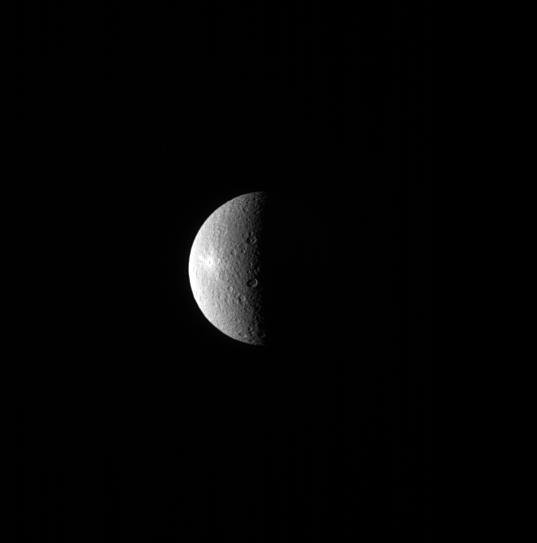 A bright spot can be seen on the left side of Rhea in this image. The spot is the crater Inktomi, named for a Lakota spider spirit.  Inktomi is believed to be the youngest feature on Rhea (949 miles or 1527 kilometers across). The relative youth of the feature is evident by its brightness. Material that is newly excavated from below the moon's surface and tossed across the surface by a cratering event, appears bright. But as the newly exposed surface is subjected to the harsh space environment, it darkens. This is one technique scientists use to date features on surfaces.  This view looks toward the trailing hemisphere of Rhea. North on Rhea is up and rotated 21 degrees to the left. The image was taken in visible light with the Cassini spacecraft narrow-angle camera on July 29, 2013.  The view was obtained at a distance of approximately 1.0 million miles (1.6 million kilometers) fro  http://photojournal.jpl.nasa.gov/catalog/PIA18300