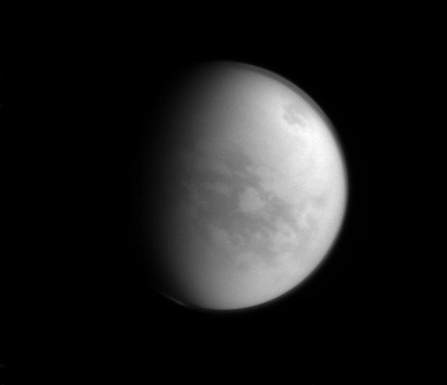 Named after a Japanese paradise, the Senkyo region of Titan (the dark area below and to the right of center) is a bit less welcoming than its namesake.  With a very inhospitable average temperature of approximately 290 degrees below zero Fahrenheit (-180 degrees Celsius), water on Titan (3,200 miles or 5,150 kilometers across) freezes hard enough to be essentially considered rock.  This view looks toward the Saturn-facing side of Titan. North on Titan is up and rotated 33 degrees to the right. The image was taken with the Cassini spacecraft narrow-angle camera on Jan. 8, 2015 using a near-infrared filter which is centered at 938 nanometers.  The view was acquired at a distance of approximately 1.2 million miles (1.9 million kilometers) from Titan. Image scale is 7 miles (11 kilometers) per pixel.  http://photojournal.jpl.nasa.gov/catalog/pia18309