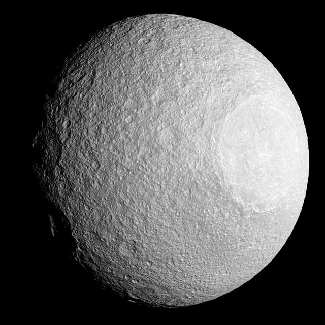 Like most moons in the solar system, Tethys is covered by impact craters. Some craters bear witness to incredibly violent events, such as the crater Odysseus (seen here at the right of the image).  While Tethys is 660 miles (1,062 kilometers) across, the crater Odysseus is 280 miles (450 kilometers) across, covering about 4.5 percent of the moon's surface area. A comparably sized crater on Earth would be as large as Russia.  This view looks toward the anti-Saturn hemisphere of Tethys. North on Tethys is up and rotated 42 degrees to the right. The image was taken in visible light with the Cassini spacecraft narrow-angle camera on April 11, 2015.  The view was acquired at a distance of approximately 118,000 miles (190,000 kilometers) from Tethys. Image scale is 3,280 feet (1 kilometer) per pixel.  http://photojournal.jpl.nasa.gov/catalog/pia18317