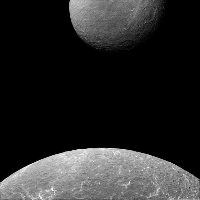 Is Dione (698 miles or 1123 kilometers across) suddenly larger than Rhea (949 miles or 1527 kilometers across)? No, of course not. Cassini simply captured an image when Dione was much closer to the camera, making the moon appear much bigger than her larger sister moon. Besides their beauty, images like these can help Cassini's navigators determine exactly where the spacecraft is and confirm that it is on course. This view looks toward the trailing hemisphere of Dione. North on Dione is up. The image was taken in visible light with the Cassini spacecraft narrow-angle camera on April 11, 2015. The view was obtained at a distance of approximately 68,000 miles (110,000 kilometers) from Dione and at a Sun-Dione-spacecraft, or phase, angle of 29 degrees. Image scale at Dione is 2,165 feet (660 meters) per pixel. Rhea was 300,000 miles (500,000 kilometers) away at a phase (Sun-Rhea-spacecraft) angle of 30 degrees. The image scale at Rhea is 2 miles (3 kilometers) per pixel. http://photojournal.jpl.nasa.gov/catalog/pia18319