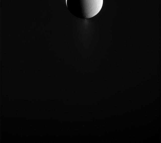 Enceladus looks as though it is half lit by sunlight in this view from NASA's Cassini spacecraft, but looks can be deceiving. The area on the right, where surface features can be made out, are actually illuminated by light reflected off of Saturn. A sliver of surface illuminated by direct sunlight is visible on the left. Images like this one are designed to capture the extended plume of icy material spraying from the moon's south polar region. Such images need to be taken with Cassini looking toward the icy moon's night side, since the small particles in the plume are most easily seen when backlit by the sun. This view looks toward the leading hemisphere of Enceladus. North on Enceladus is up. The image was taken in visible light with Cassini's narrow-angle camera on May 10, 2015. Enceladus is 313 miles (504 kilometers) across. The view was acquired at a distance of approximately 226,000 miles (364,000 kilometers) from Enceladus and at a Sun-Enceladus-spacecraft, or phase, angle of 152 degrees. Image scale is 1.4 miles (2.2 kilometers) per pixel. http://photojournal.jpl.nasa.gov/catalog/PIA18328