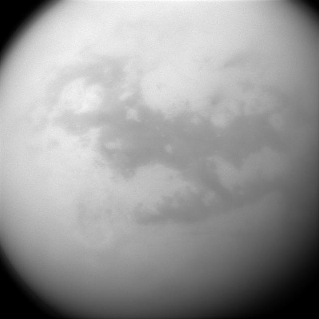 Saturn's frigid moon Titan has some characteristics that are oddly similar to Earth, but still slightly alien. It has clouds, rain and lakes (made of methane and ethane), a solid surface (made of water ice), and vast dune fields (filled with hydrocarbon sands).  The dark, H-shaped area seen here contains two of the dune-filled regions, Fensal (in the north) and Aztlan (to the south).  Cassini's cameras have frequently monitored the surface of Titan (3200 miles or 5150 kilometers across) to look for changes in its features over the course of the mission. Any changes would help scientists better understand different phenomena like winds and dune formation on this strangely earth-like moon.  For a closer view of Fensal-Aztlan, see PIA07732 .  This view looks toward the leading side of Titan. North on Titan is up. The image was taken with the Cassini spacecraft narrow-angle camera on July 25, 2015 using a spectral filter sensitive to wavelengths of near-infrared light centered at 938 nanometers.  The view was obtained at a distance of approximately 450,000 miles (730,000 kilometers) from Titan and at a Sun-Titan-spacecraft, or phase, angle of 32 degrees. Image scale is 3 miles (4 kilometers) per pixel.   http://photojournal.jpl.nasa.gov/catalog/PIA18341