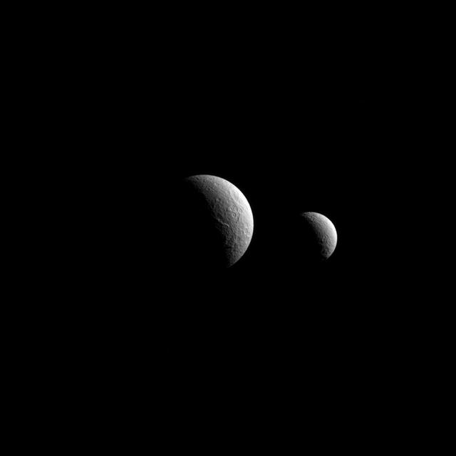he view from NASA Cassini spacecraft looks toward the anti-Saturn sides of Tethys and Rhea. North on both moons is up. Rhea and Tethys are medium-sized moons that are large enough to have pulled themselves into round shapes.