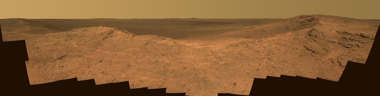 This scene from the panoramic camera Pancam on NASA Mars Exploration Rover Opportunity catches Pillinger Point, on the western rim of Endeavour Crater, in the foreground.
