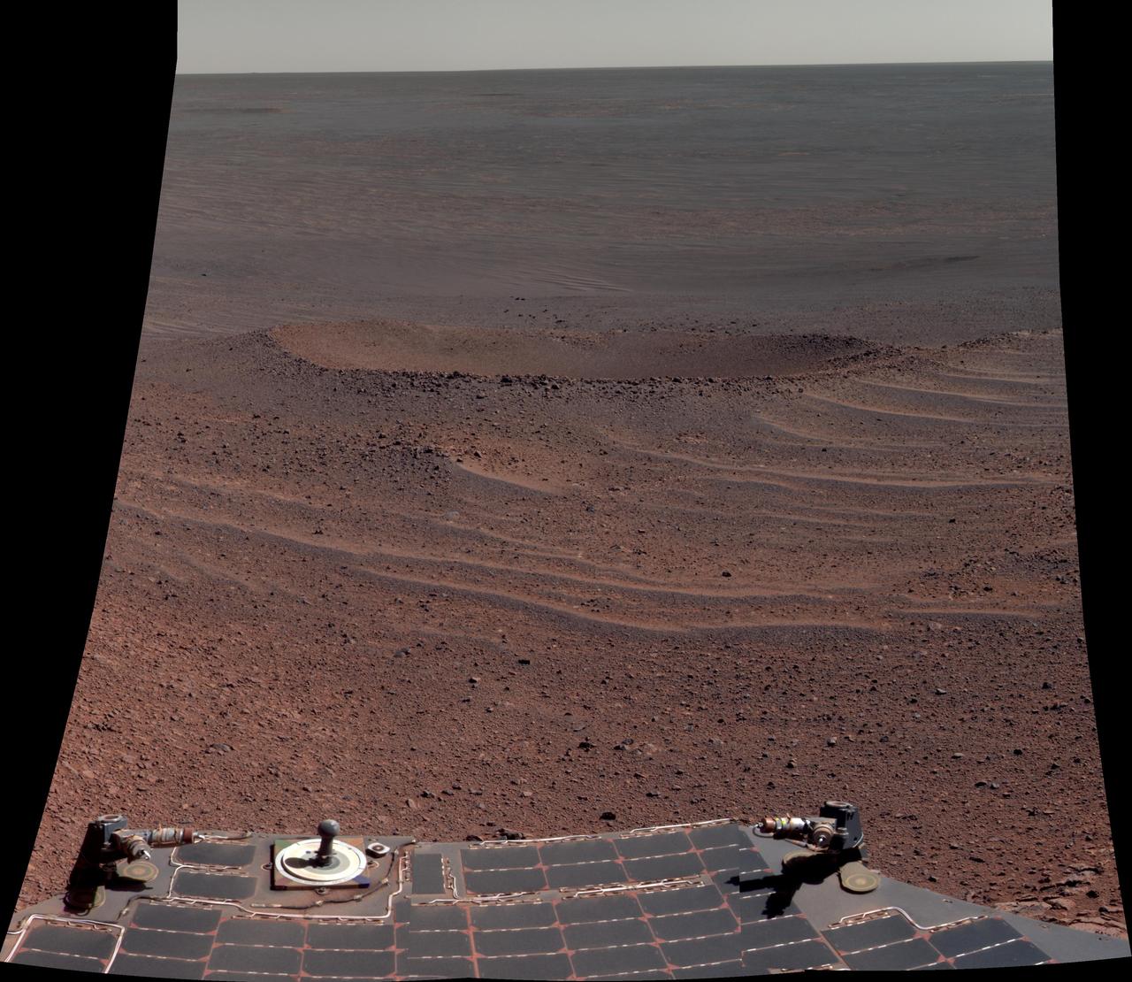This scene from NASA Opportunity rover shows Lunokhod 2 Crater, which lies south of Solander Point on the west rim of Endeavour Crater. Lunokhod 2 Crater is approximately 20 feet 6 meters in diameter.