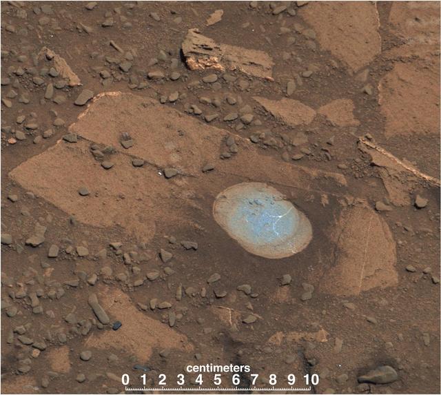 A swept Martian rock called Bonanza King can be seen in this image take by NASA Mars Curiosity rover. This rock is located across the boundary that defines the base of Mount Sharp.