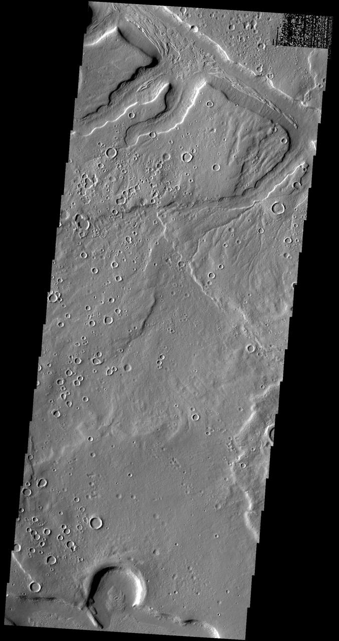 This image captured by NASA 2001 Mars Odyssey spacecraft shows part of one of the numerous unnamed channels that dissect the northern margin of Arabia Terra.