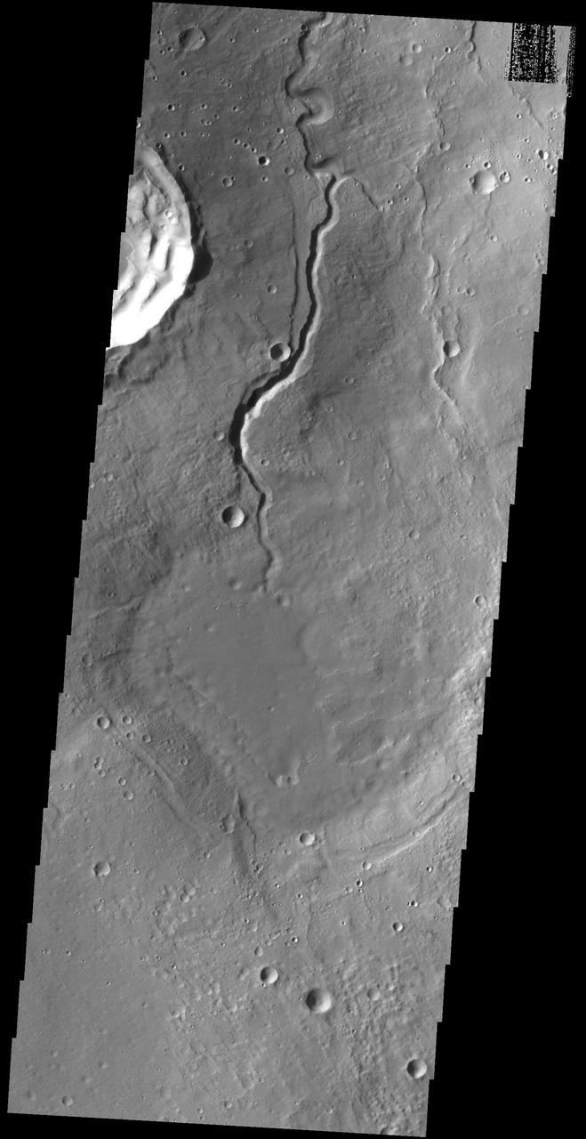 Like the previous image from NASA 2001 Mars Odyssey spacecraft, this one shows one of the many unnamed channels on the northern margin of Arabia Terra.