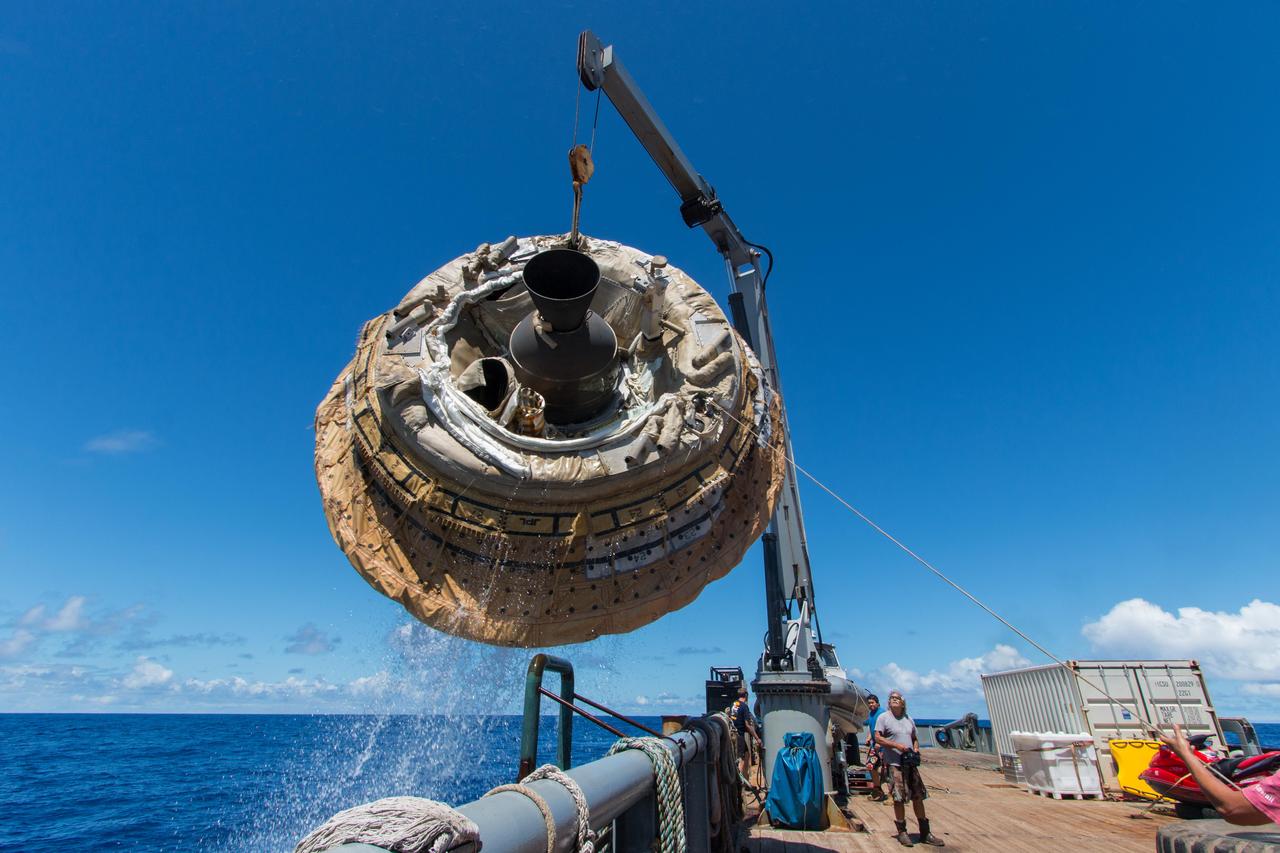 Hours after the June 28, 2014, test of NASA Low-Density Supersonic Decelerator over the U.S. Navy Pacific Missile Range, the saucer-shaped test vehicle is lifted aboard the Kahana recovery vessel.
