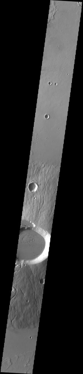 This image captured by NASA 2001 Mars Odyssey spacecraft crosses the summit of Ceraunius Tholus.