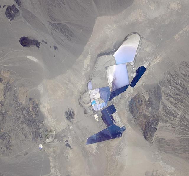 This image from NASA Terra spacecraft shows the once-abandoned mining town of Silver Peak, Nevada, which began to thrive again when Foote Mineral Company began extracting lithium from brine below the floor of Clayton Valley in 1966.