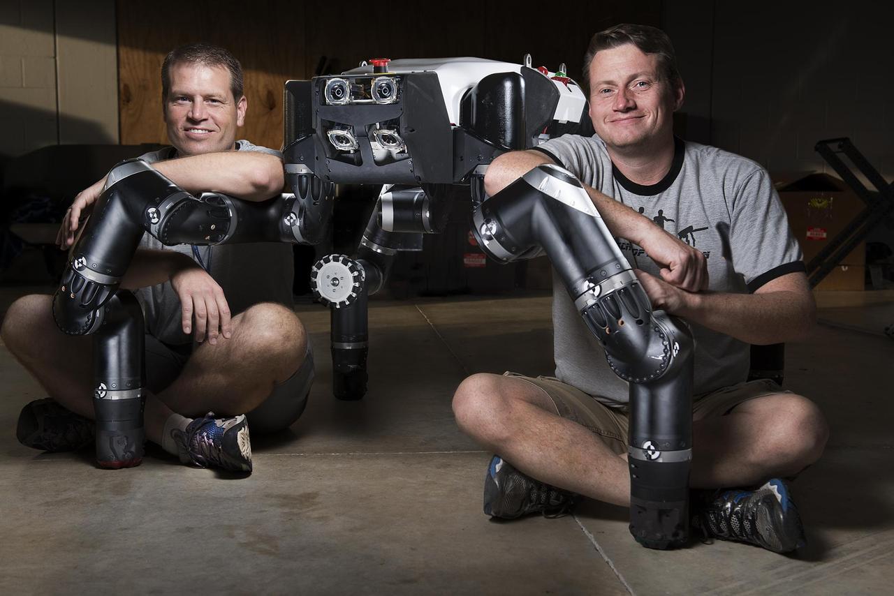 Limbed robot RoboSimian was developed at NASA Jet Propulsion Laboratory, seen here with Brett Kennedy, supervisor of the JPL Robotic Vehicles and Manipulators Group, and Chuck Bergh, a senior engineer in JPL Robotic Hardware Systems Group.