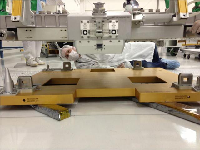 An engineer from NASA Jet Propulsion Laboratory oversees a fit check during the integration & testing of the Optical PAyload for Lasercomm Science OPALS.