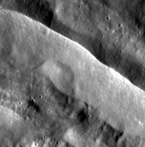 Watchers of the Wall. This image from NASA MESSENGER spacecraft features the sharp rim of an unnamed complex crater on Mercury.