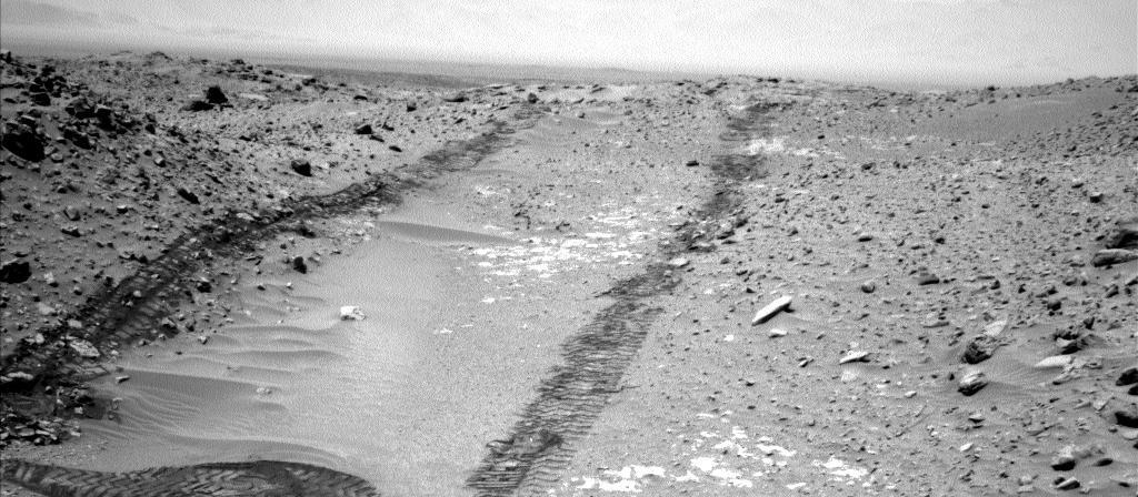 In this image from NASA Curiosity Mars rover looking up the ramp at the northeastern end of Hidden Valley, a pale outcrop including drilling target Bonanza King is at the center of the scene.