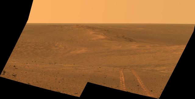 This scene from the Pancam on NASA Mars Exploration Rover Opportunity looks back toward part of the west rim of Endeavour Crater that the rover drove along, heading southward, during the summer of 2014.