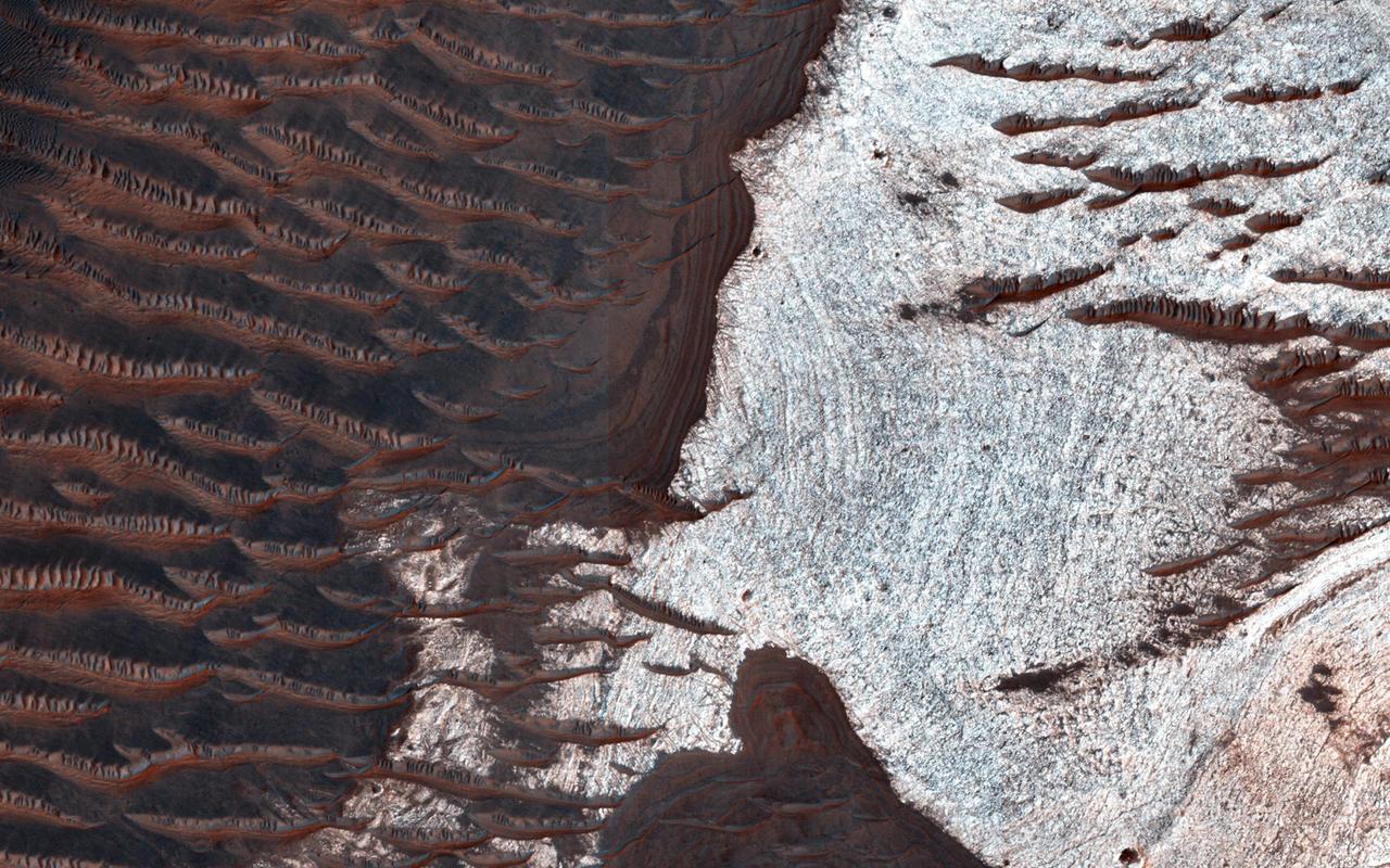 Many of the depressions in Noctis Labyrinthus contain water-bearing minerals, suggesting that water was available and persistent in this region during the Late Hesperian to Amazonian epochs on Mars, as seen by NASA Mars Reconnaissance Orbiter.