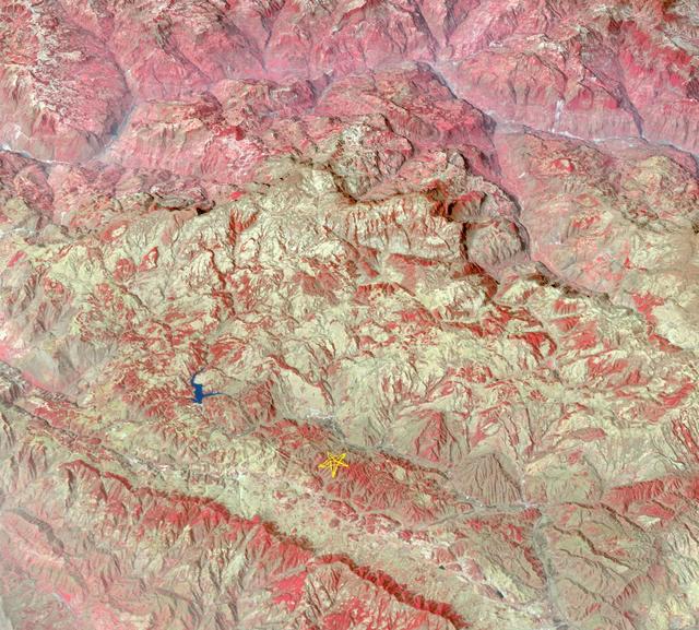 The star on this image from the NASA Terra spacecraft indicates the eipcenter of a magnitude 6.1 earthquake which truck in southern China Yunnan province, toppling thousands of homes and causing numerous casualties.