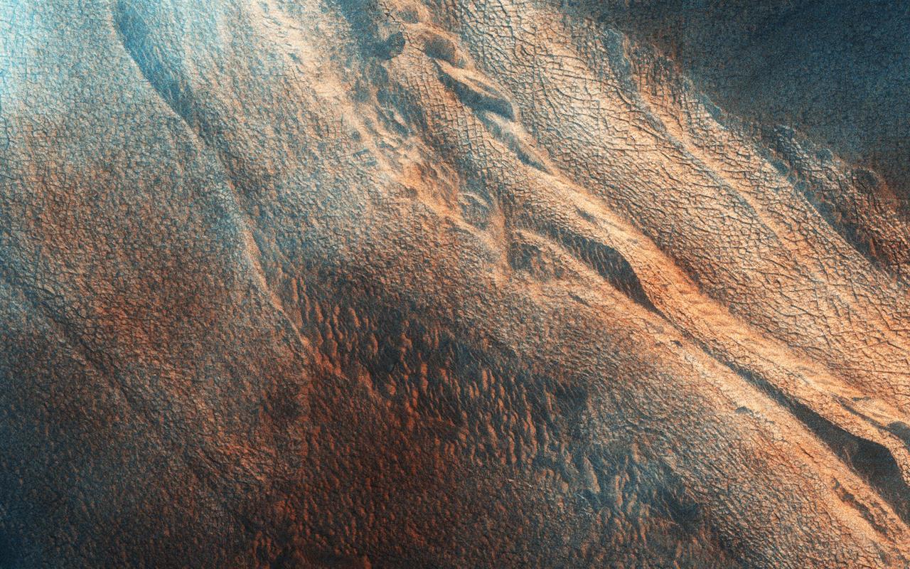 The north end of this long image from NASA Mars Reconnaissance Orbiter shows a lava surface in southern Elysium Planitia. Small cones are common on the extensive young flood lavas in this region.