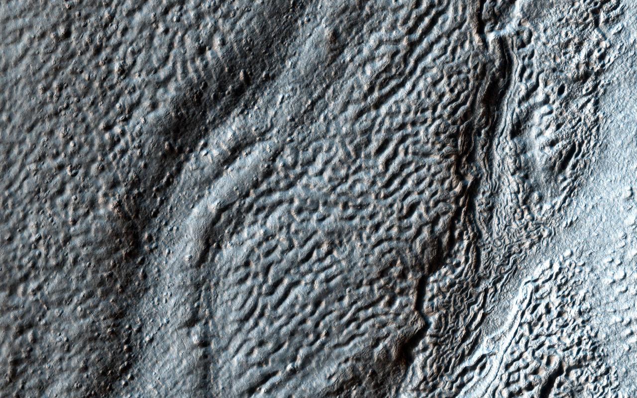 Hellas Crater in the ancient highlands contains some of the clearest evidence on Mars for glacial processes. This image from NASA Mars Reconnaissance Orbiter shows a number of features consistent with glaciation.