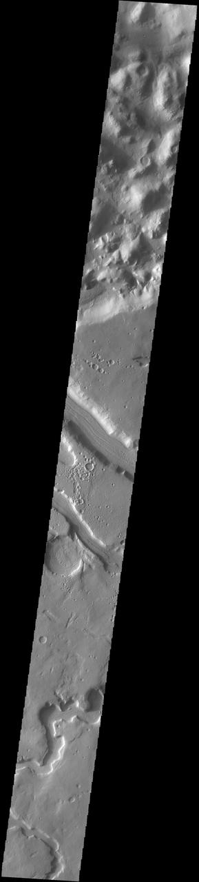 The sinuous channel at the bottom of this image captured by NASA 2001 Mars Odyssey spacecraft is called Anio Valles.