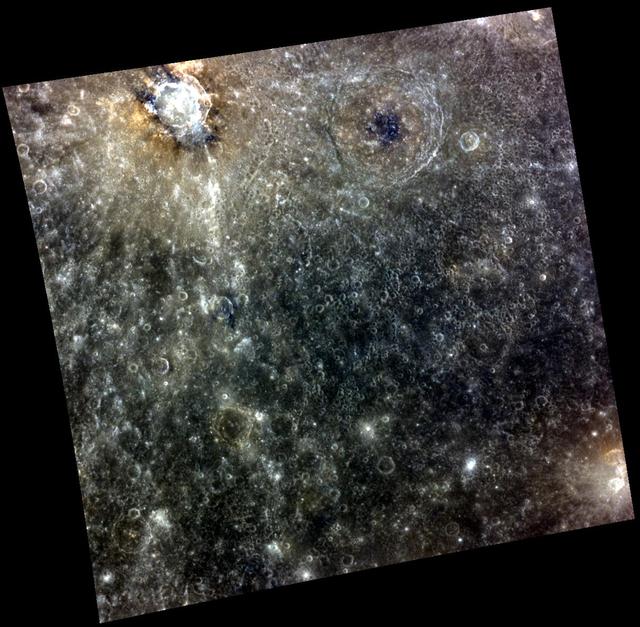 I am the MESSENGER, I Speak for the Craters. In the top left part of this image from NASA MESSENGER spacecraft is, a complex crater with hollows present on the crater floor. The hollows appear as bright blue-white features.