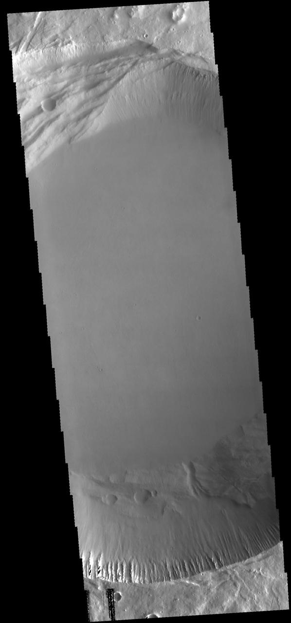 This image from NASA 2001 Mars Odyssey spacecraft shows the summit caldera of Pavonis Mons.