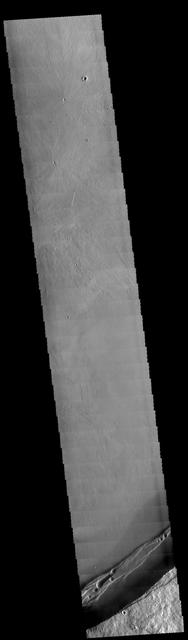 This image captured by NASA 2001 Mars Odyssey spacecraft shows part of the caldera at the summit of Arsia Mons.