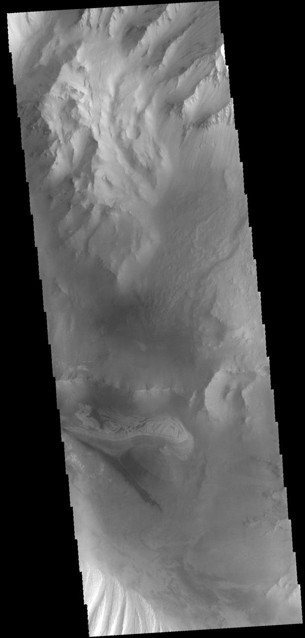 This image captured by NASA 2001 Mars Odyssey spacecraft shows part of the floor of Candor Chasma.