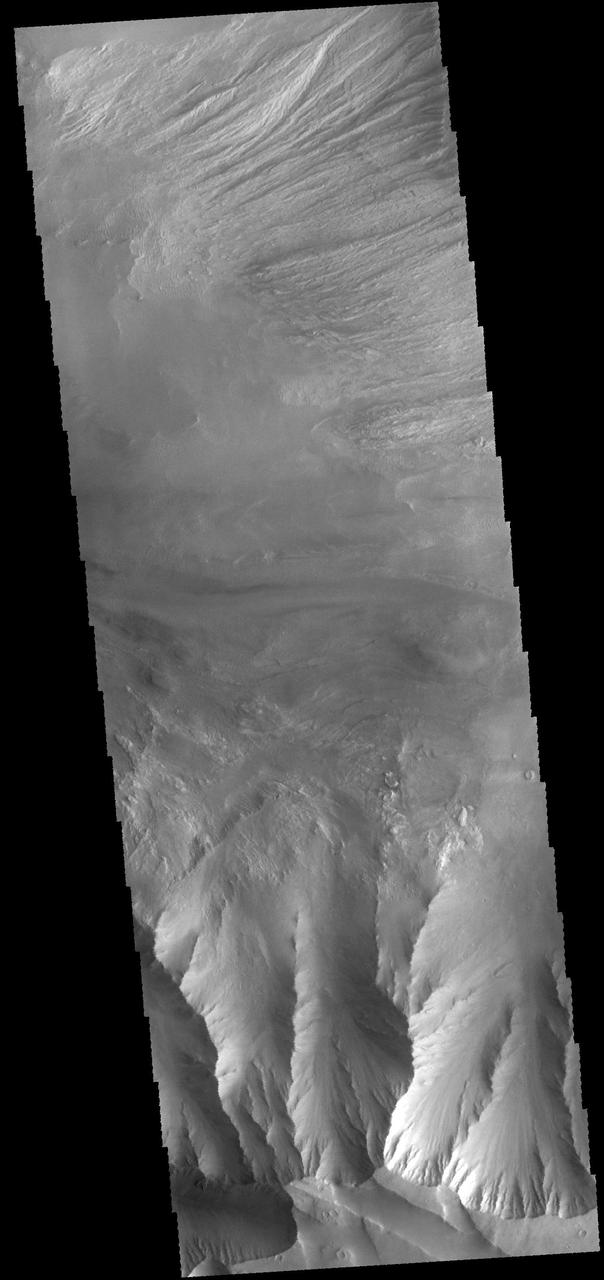 This image captured by NASA 2001 Mars Odyssey spacecraft shows eroded materials on the floor of Candor Chasma.