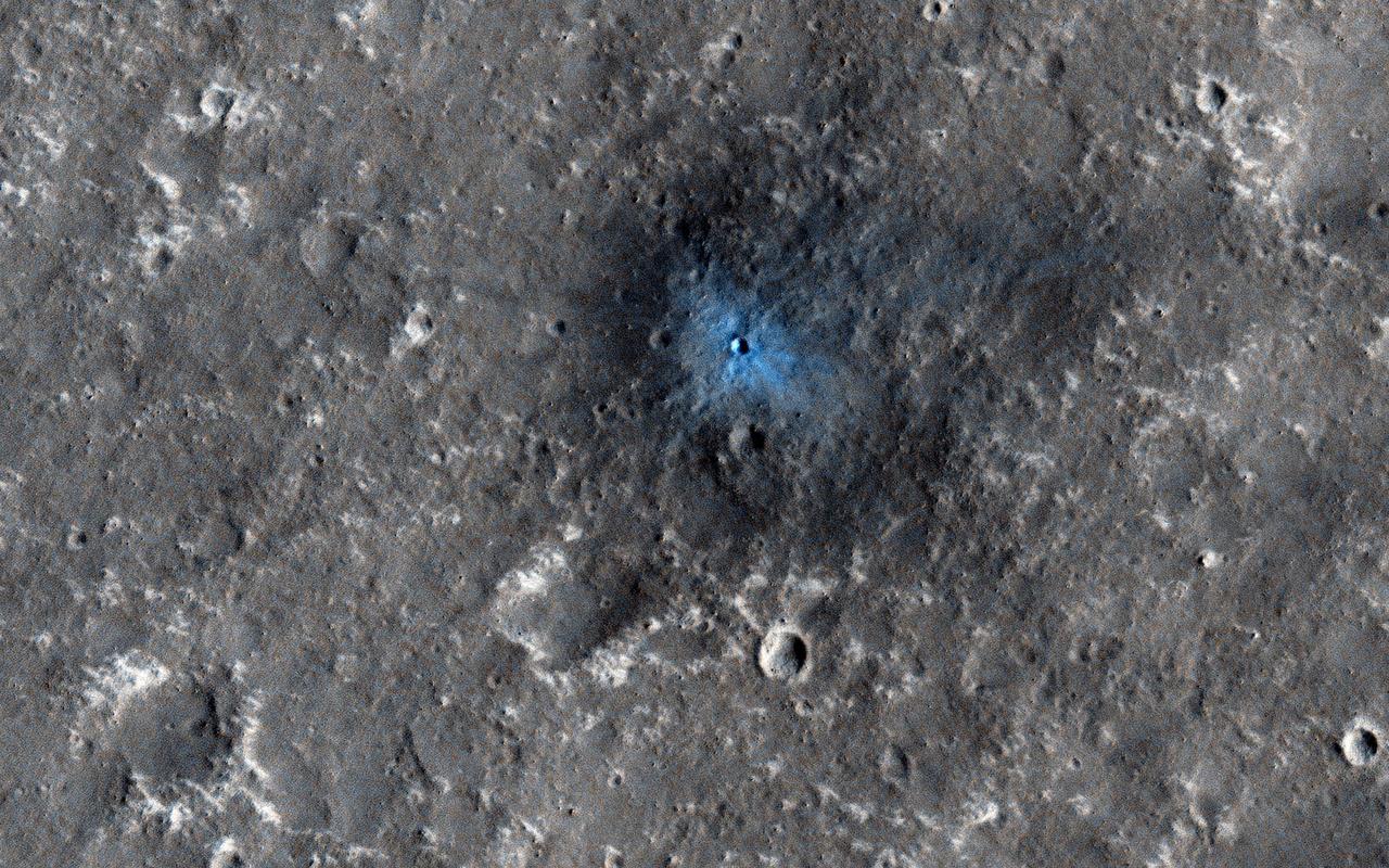 This recent image from NASA Mars Reconnaissance Orbiter, acquired to certify a landing site for NASAa InSight mission, shows a distinctive crater with a very sharp rim and ejecta.
