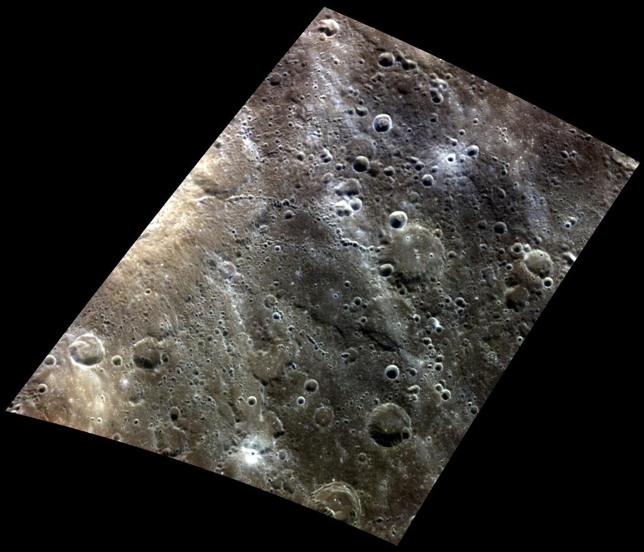 Crossing Paths. At the left edge of this color view is a relatively fresh crater as seen by NASA MESSENGER spacecraft.