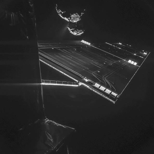 A composite image from a camera on ESA Rosetta mission Philae comet lander shows a solar array, with comet 67P/Churyumov-Gerasimenko in the background.