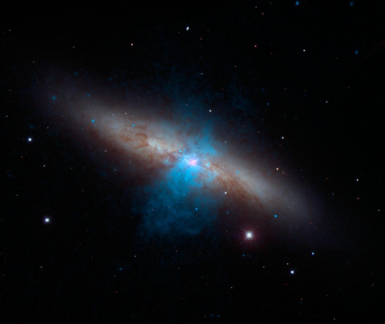 The bulk of a galaxy called Messier 82 M82, or the Cigar galaxy, is seen in visible-light data captured by the National Optical Astronomy Observatory 2.1-meter telescope at Kitt Peak in Arizona.