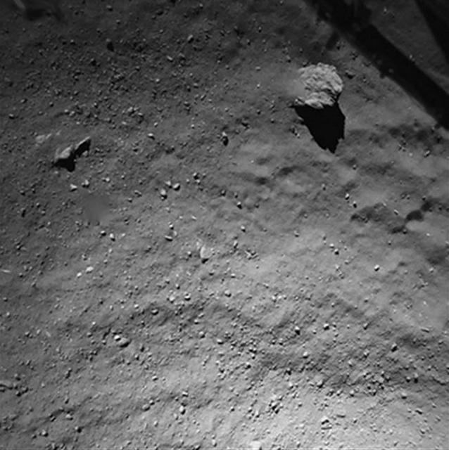 This image was taken by the Philae lander of the European Space Agency Rosetta mission when it was about 130 feet 40 meters above the surface of comet 67P/Churyumov-Gerasimenko during descent to the surface on Nov. 12, 2014.