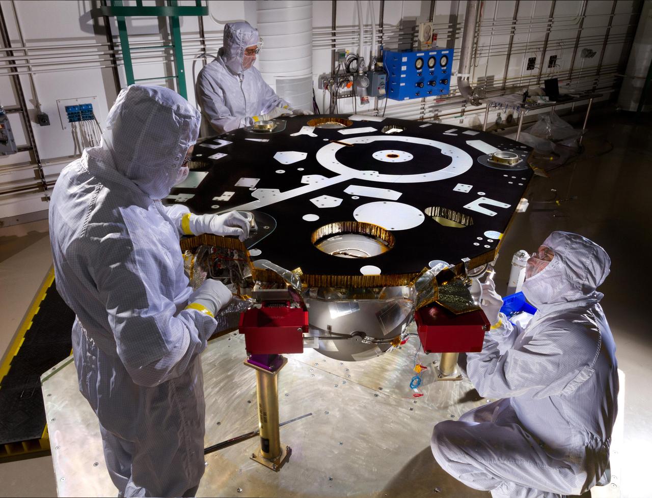 Technicians in a Lockheed Martin clean room near Denver prepare NASA's InSight Mars lander for propulsion proof and leak testing on Oct. 31, 2014. Following the test, the lander was moved to another clean room for the start of the mission's assembly, test and launch operations (ATLO) phase. The assembly portion of ATLO will last about six months. The InSight mission (for Interior Exploration using Seismic Investigations, Geodesy and Heat Transport) is scheduled to launch in March 2016 and land on Mars six months later. It will investigate processes that formed and shaped Mars and will help scientists better understand the evolution of our inner solar system's rocky planets, including Earth. Note: After thorough examination, NASA managers have decided to suspend the planned March 2016 launch of the Interior Exploration using Seismic Investigations Geodesy and Heat Transport (InSight) mission. The decision follows unsuccessful attempts to repair a leak in a section of the prime instrument in the science payload. http://photojournal.jpl.nasa.gov/catalog/PIA18884