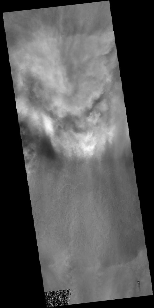 Clouds fill half of this unnamed crater located in the region between Malea Planum and Hellas Planitia, as shown in this image from NASA 2001 Mars Odyssey spacecraft.