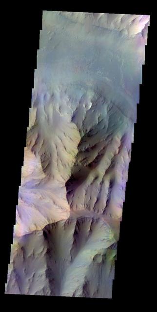 The THEMIS VIS camera contains 5 filters. The data from different filters can be combined in multiple ways to create a false color image. This false color image captured by NASA 2001 Mars Odyssey spacecraft shows part of Coprates Chasma.