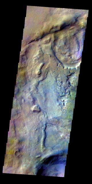 The THEMIS VIS camera contains 5 filters. The data from different filters can be combined in multiple ways to create a false color image. This false color image from NASA 2001 Mars Odyssey spacecraft shows part of the floor of Proctor Crater.