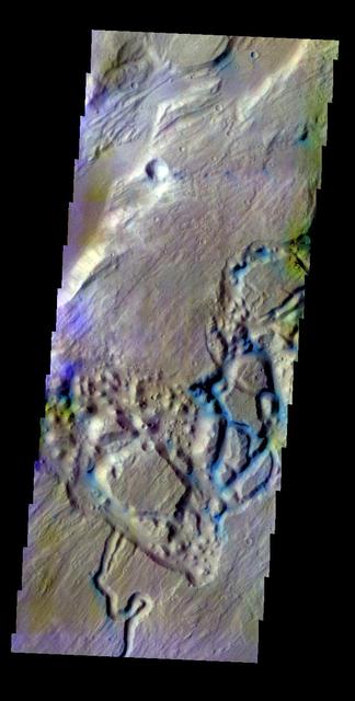 The THEMIS VIS camera contains 5 filters. The data from different filters can be combined to create a false color image. This false color image from NASA 2001 Mars Odyssey spacecraft shows part of a tributary channel that empties into Ares Vallis.