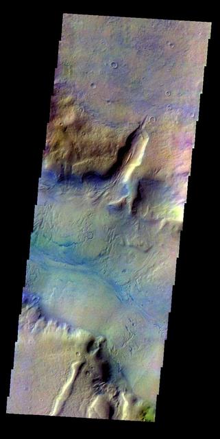 The THEMIS VIS camera contains 5 filters. The data from different filters can be combined in multiple ways to create a false color image. This false color image from NASA 2001 Mars Odyssey spacecraft shows part of Reull Vallis.
