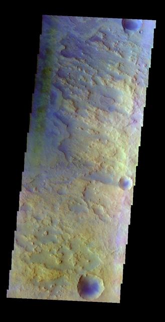 The THEMIS VIS camera contains 5 filters. The data from different filters can be combined in multiple ways to create a false color image. This false color image from NASA 2001 Mars Odyssey spacecraft shows part of the floor of Antoniadi Crater.